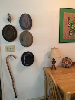 hats and cane wall