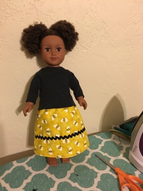 doll with yellow skirt