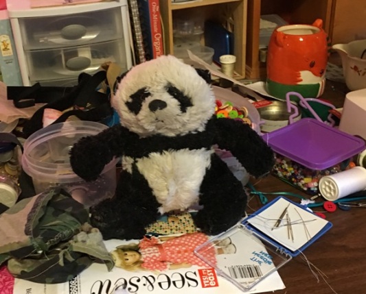 a panda on sewing table